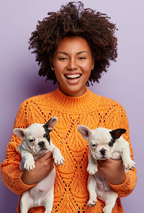 Girl holding puppies